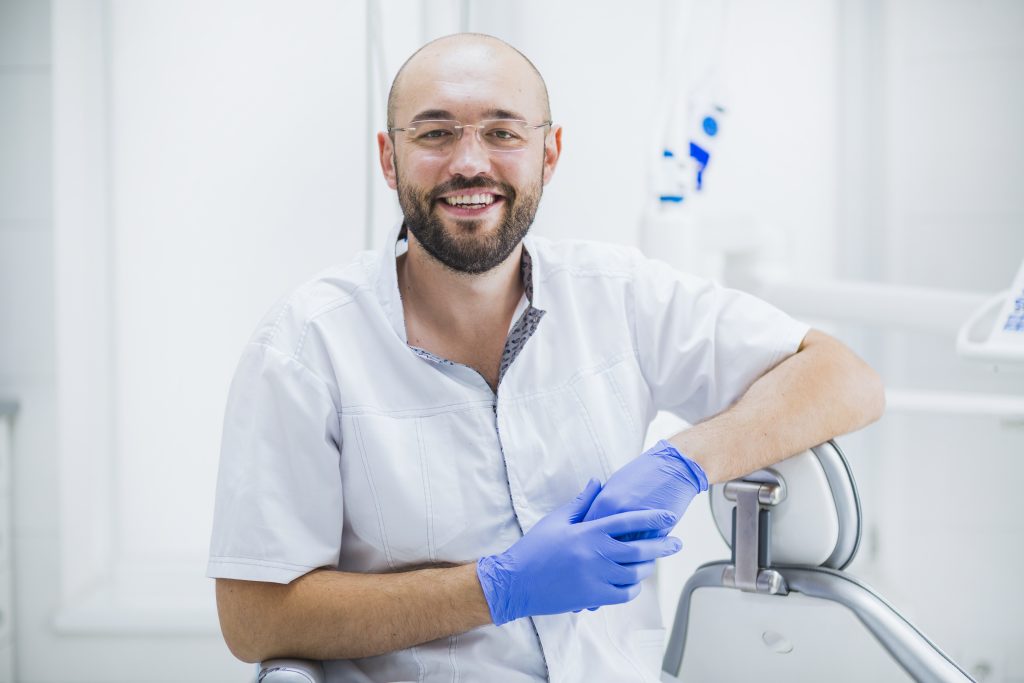portrait happy male dentist